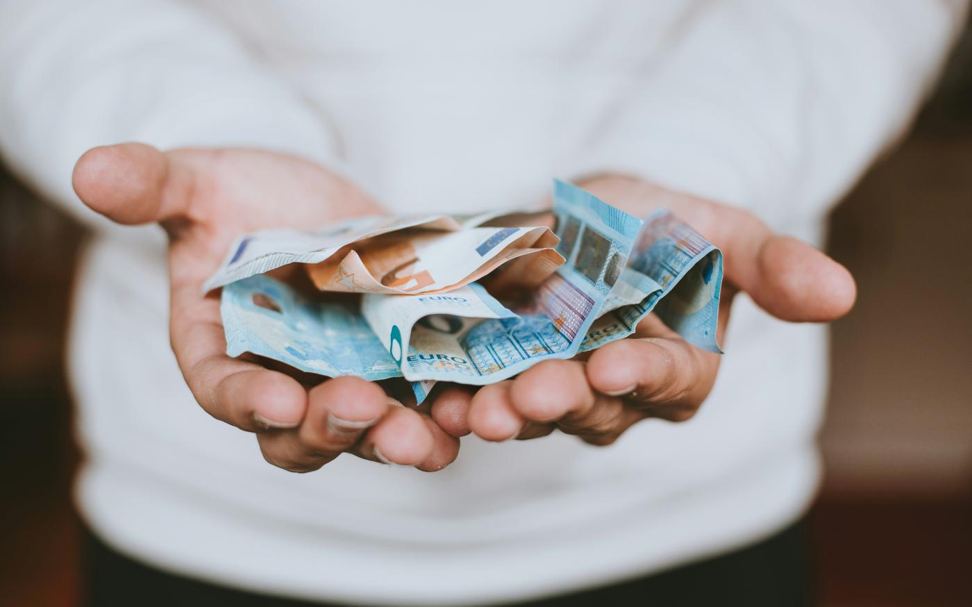 two Euro banknotes by Christian Dubovan courtesy of Unsplash.