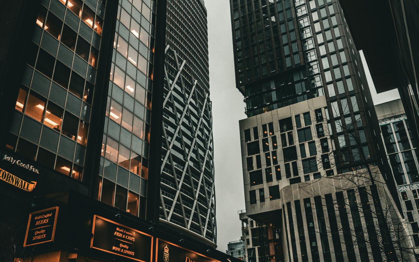 a group of tall buildings next to each other by Jonathan Gong courtesy of Unsplash.