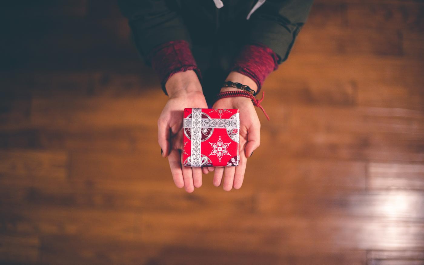 person holding red and white box by Ben White courtesy of Unsplash.