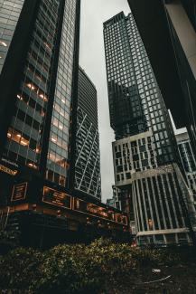 a group of tall buildings next to each other by Jonathan Gong courtesy of Unsplash.