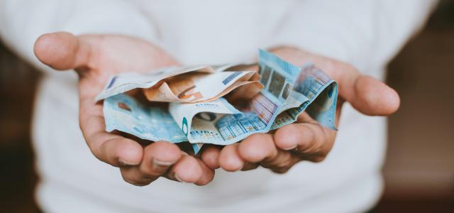 two Euro banknotes by Christian Dubovan courtesy of Unsplash.