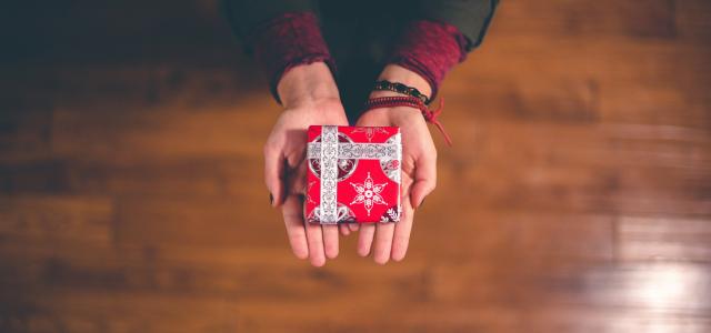 person holding red and white box by Ben White courtesy of Unsplash.